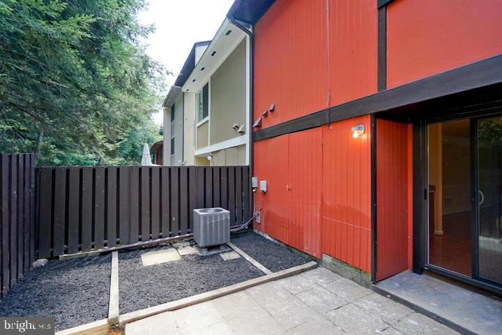 2215 Coppersmith Square Reston, VA 20191 - Photo 8 of 13 a view of outdoor space with wooden fence