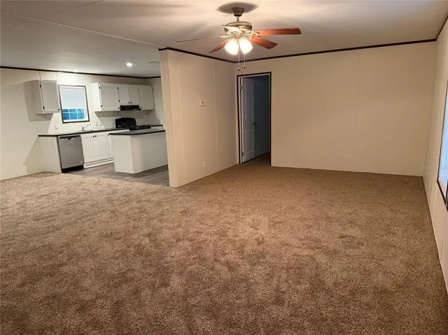 a view of a kitchen with a stove cabinets and furniture