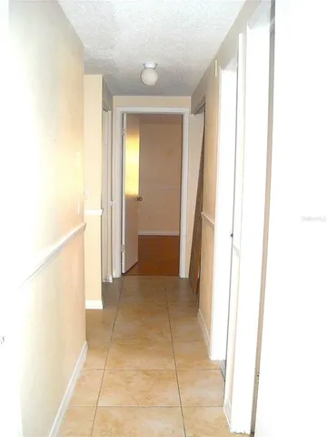 a view of a room with a hallway