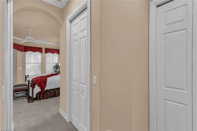 a view of a bedroom with a bed and glass door