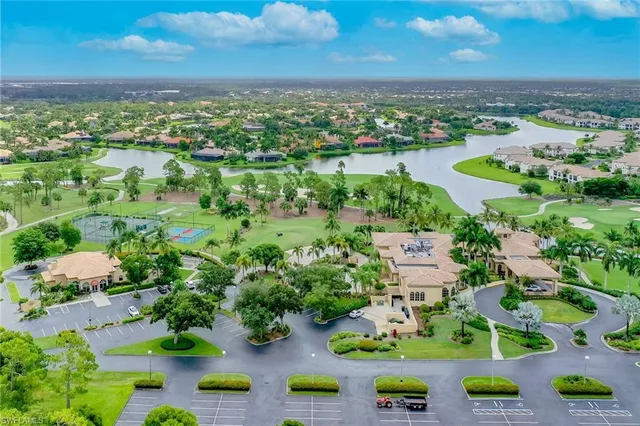 an aerial view of a house with a lake view