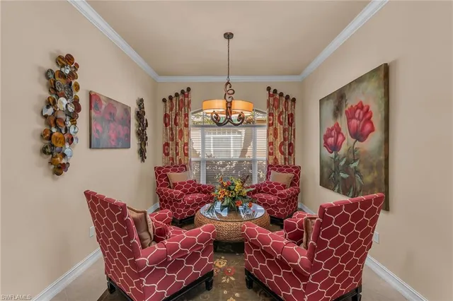 a dinning room with furniture and flowers