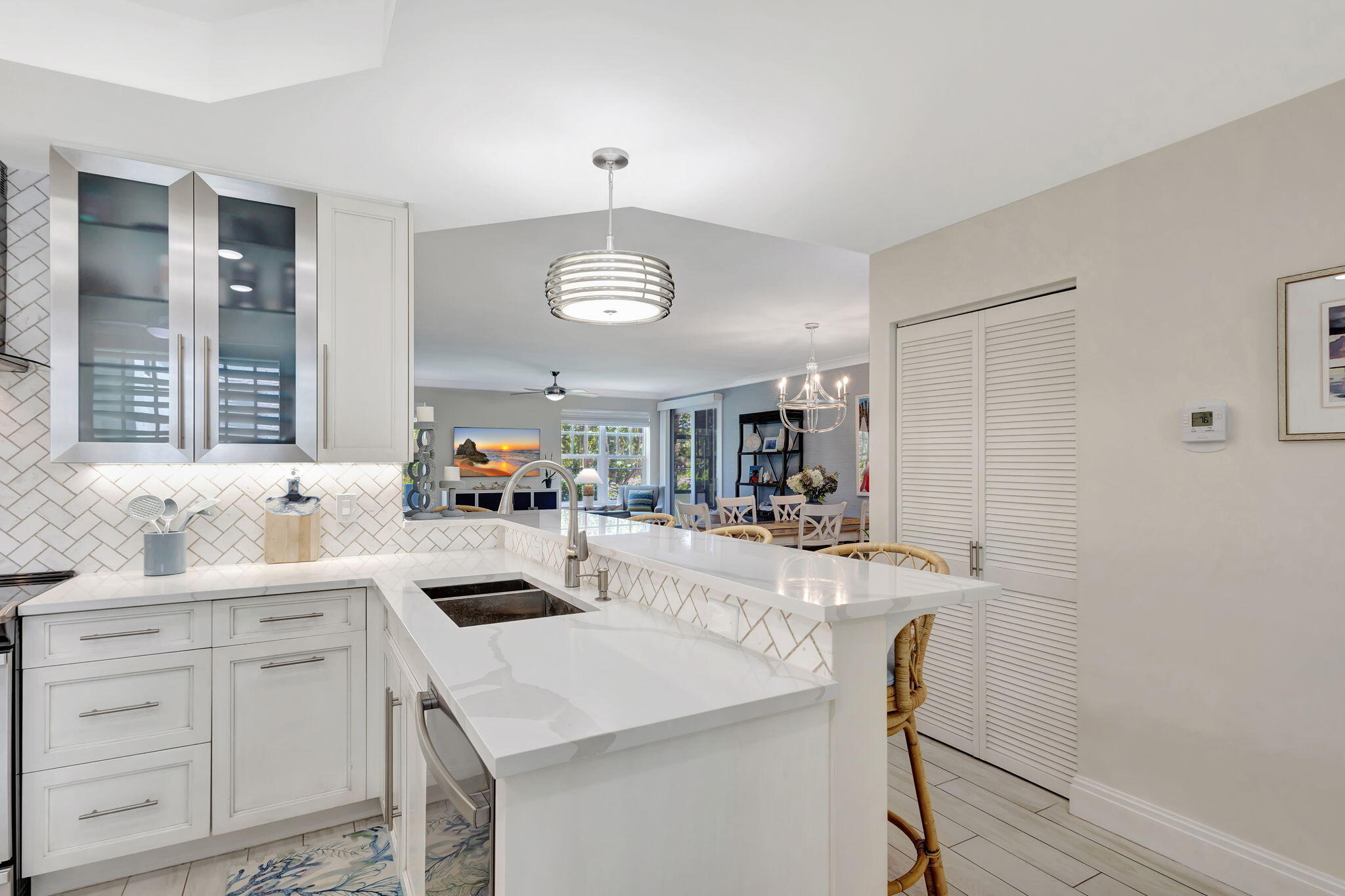 204 Mainsail Circle Jupiter, FL 33477 - Photo 16 of 60 a kitchen with a sink a stove and cabinets