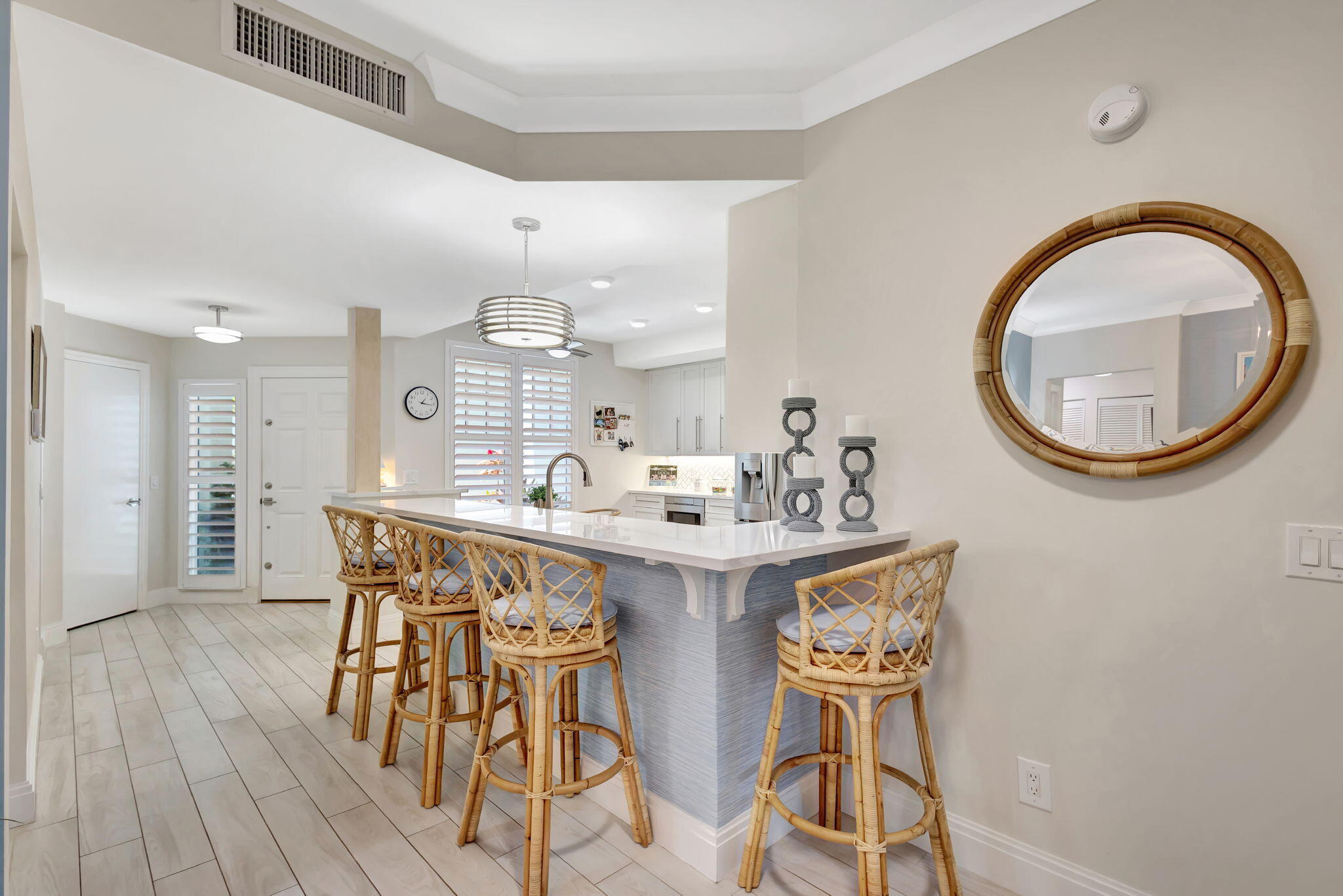 204 Mainsail Circle Jupiter, FL 33477 - Photo 17 of 60 a view of a dining room with furniture and a mirror
