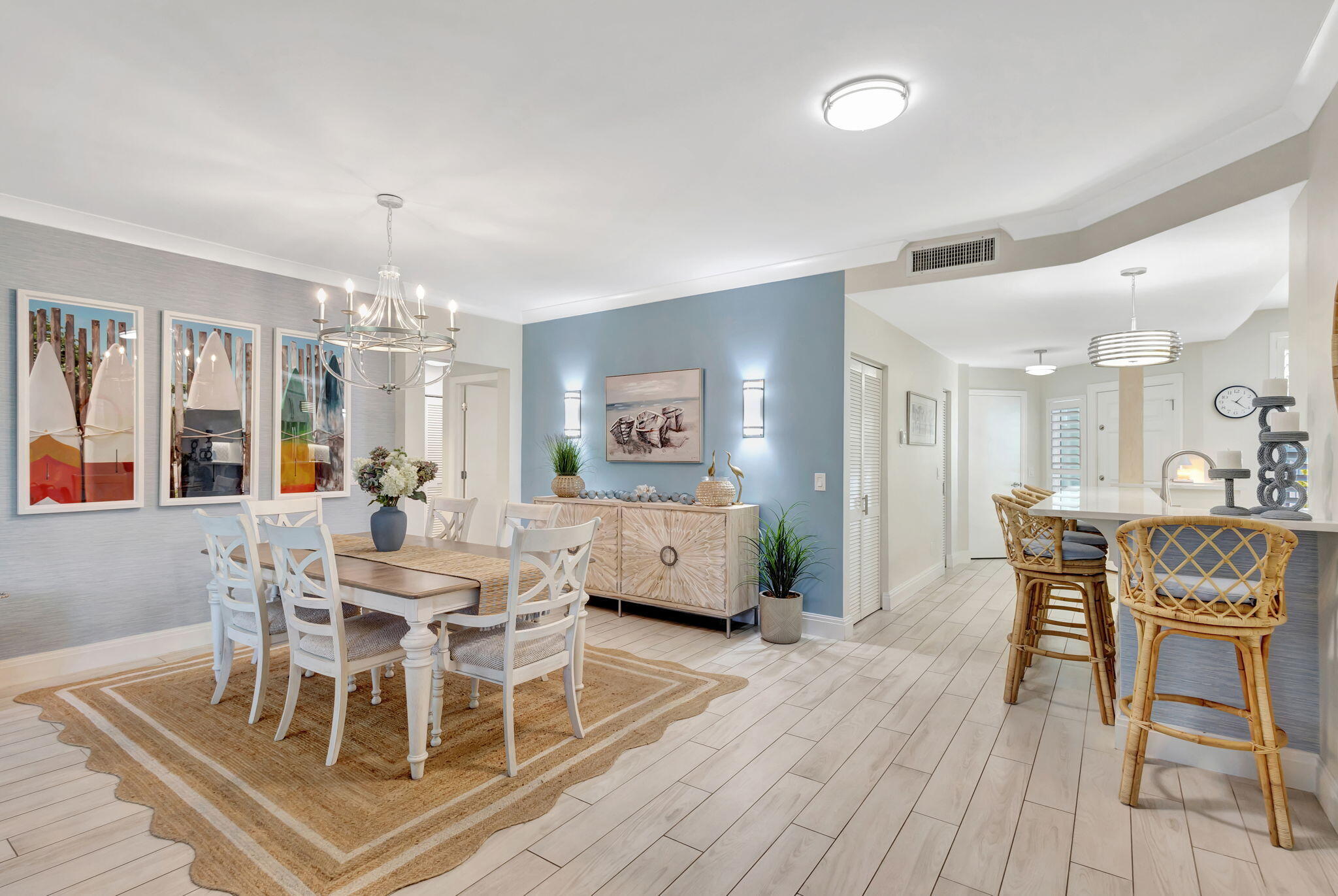 204 Mainsail Circle Jupiter, FL 33477 - Photo 19 of 60 a dining room with furniture a chandelier and wooden floor