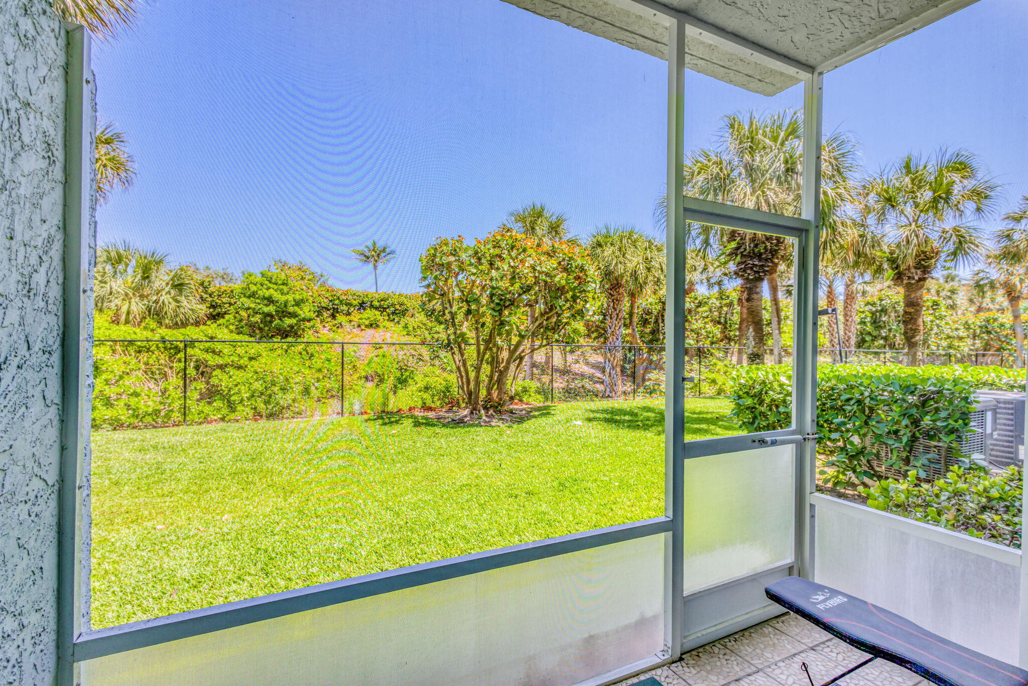 204 Mainsail Circle Jupiter, FL 33477 - Photo 36 of 60 a view of a floor to ceiling window next to a yard