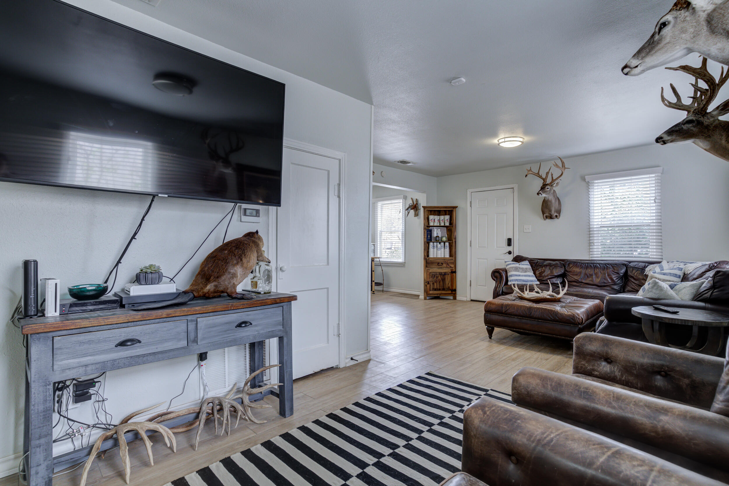 2515 33rd Street Lubbock, TX 79410 - Photo 12 of 41 a living room with furniture and a lamp