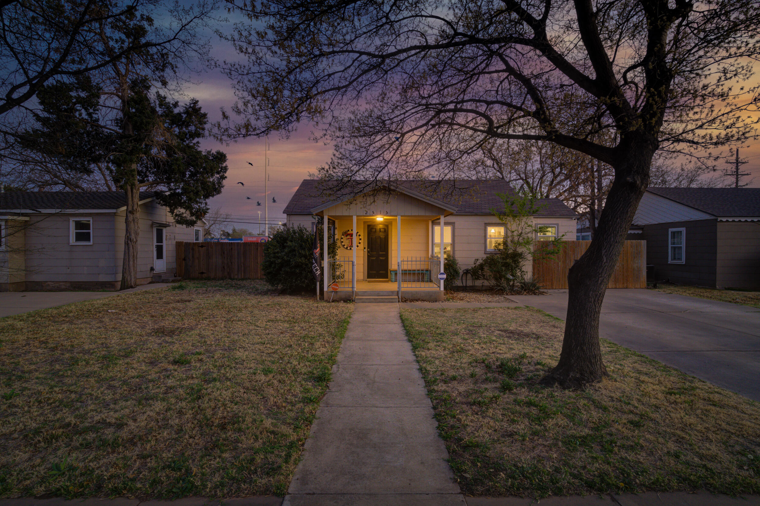 2515 33rd Street Lubbock, TX 79410 - Photo 2 of 41 a front view of a house with a yard