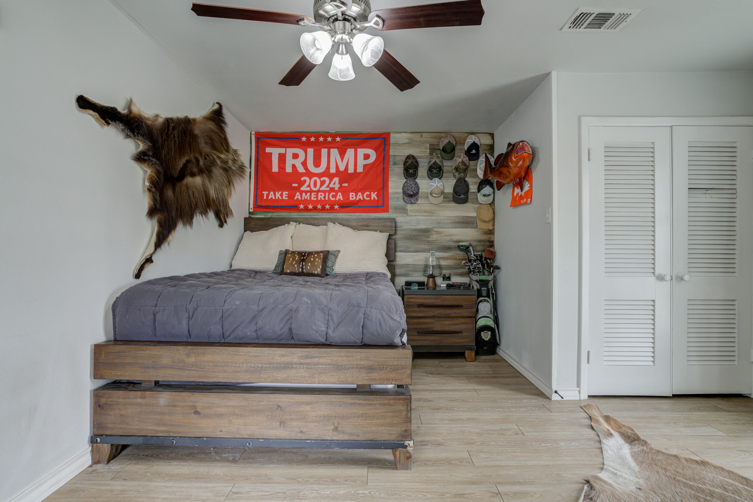 2515 33rd Street Lubbock, TX 79410 - Photo 25 of 41 a bedroom with a bed and a chandelier