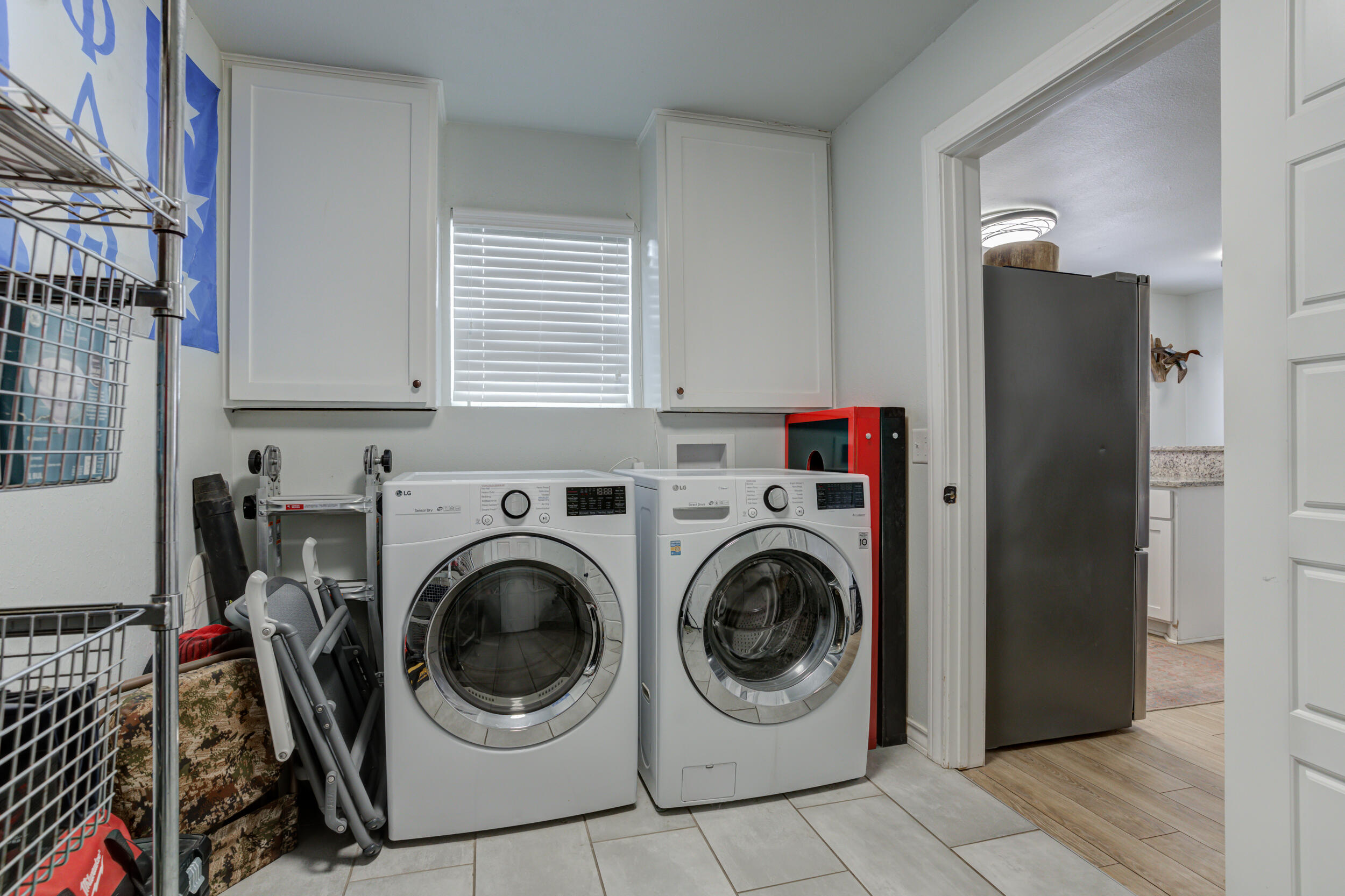 2515 33rd Street Lubbock, TX 79410 - Photo 37 of 41 a utility room with sink dryer and washer