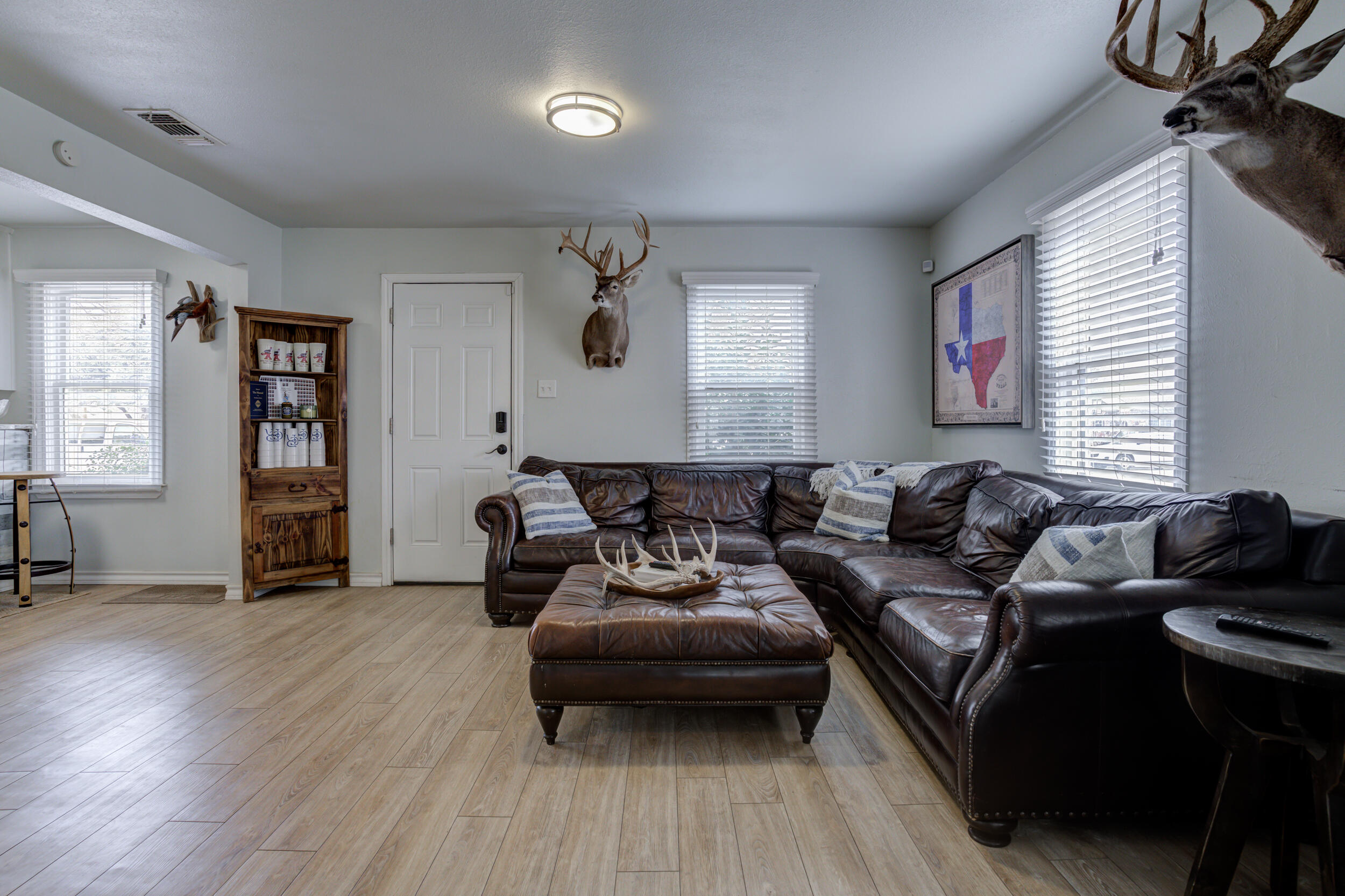2515 33rd Street Lubbock, TX 79410 - Photo 5 of 41 a living room with furniture and a wooden floor