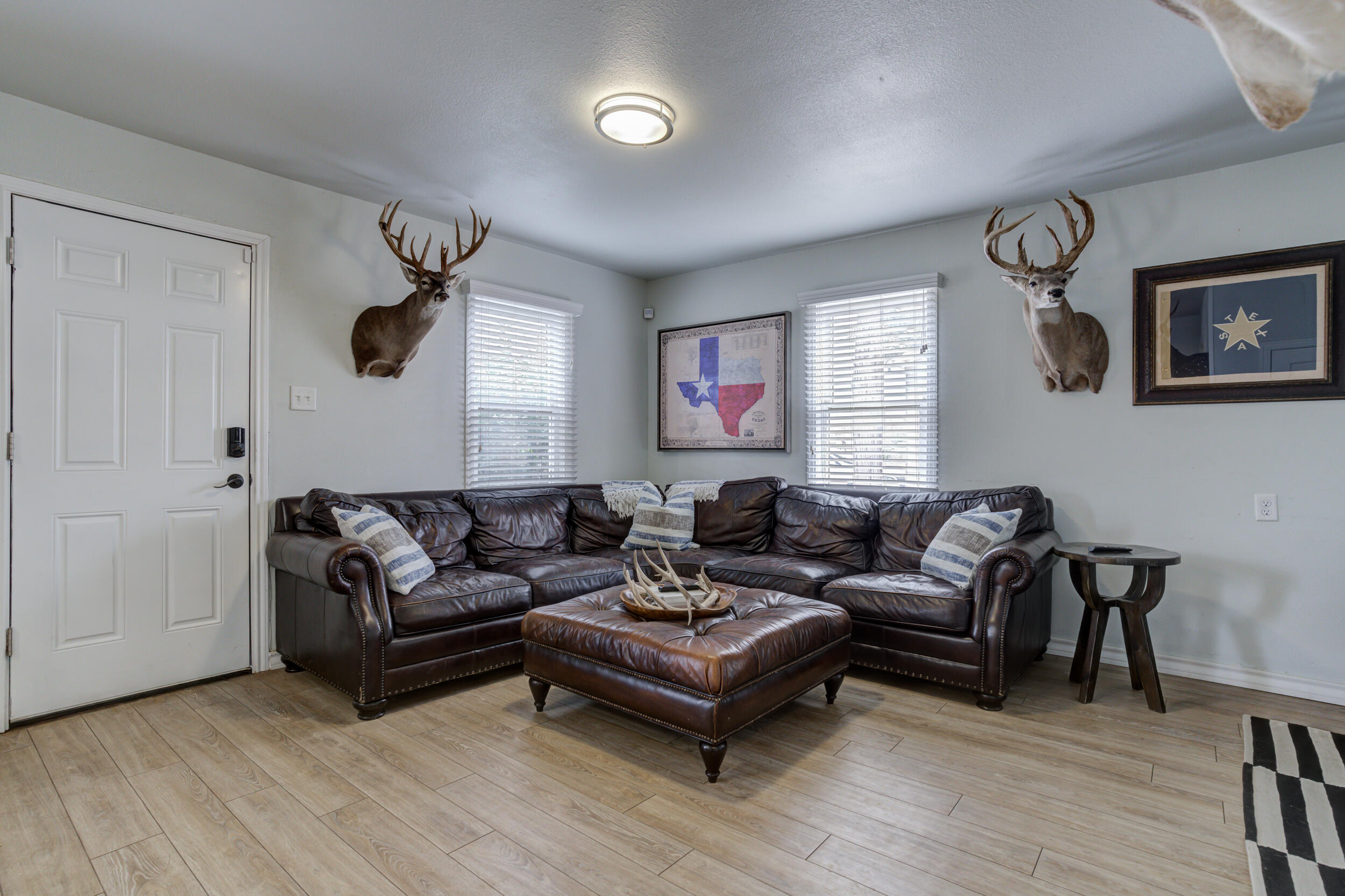 2515 33rd Street Lubbock, TX 79410 - Photo 7 of 41 a living room with furniture and a wooden floor
