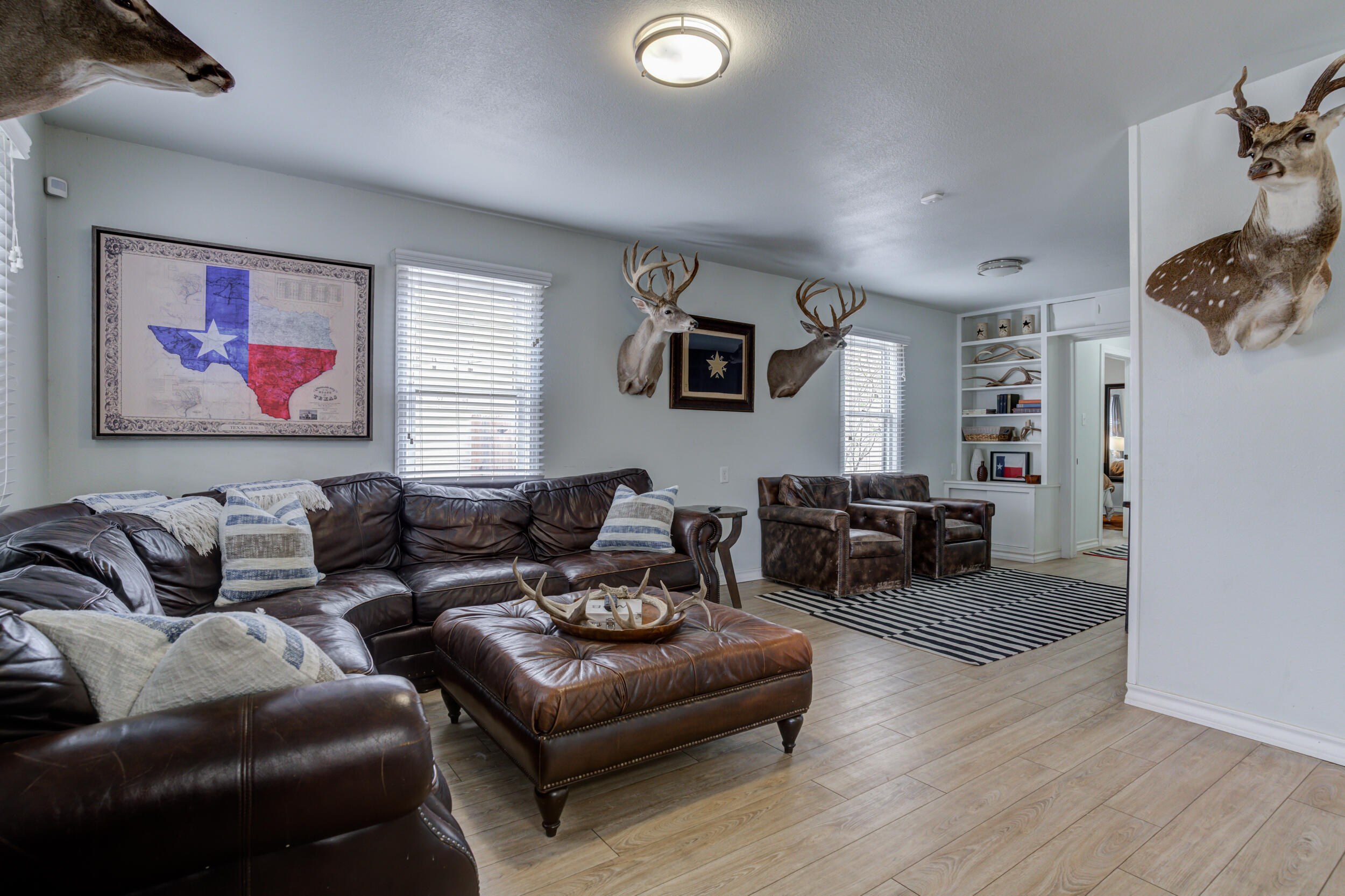 2515 33rd Street Lubbock, TX 79410 - Photo 8 of 41 a living room with furniture and a flat screen tv