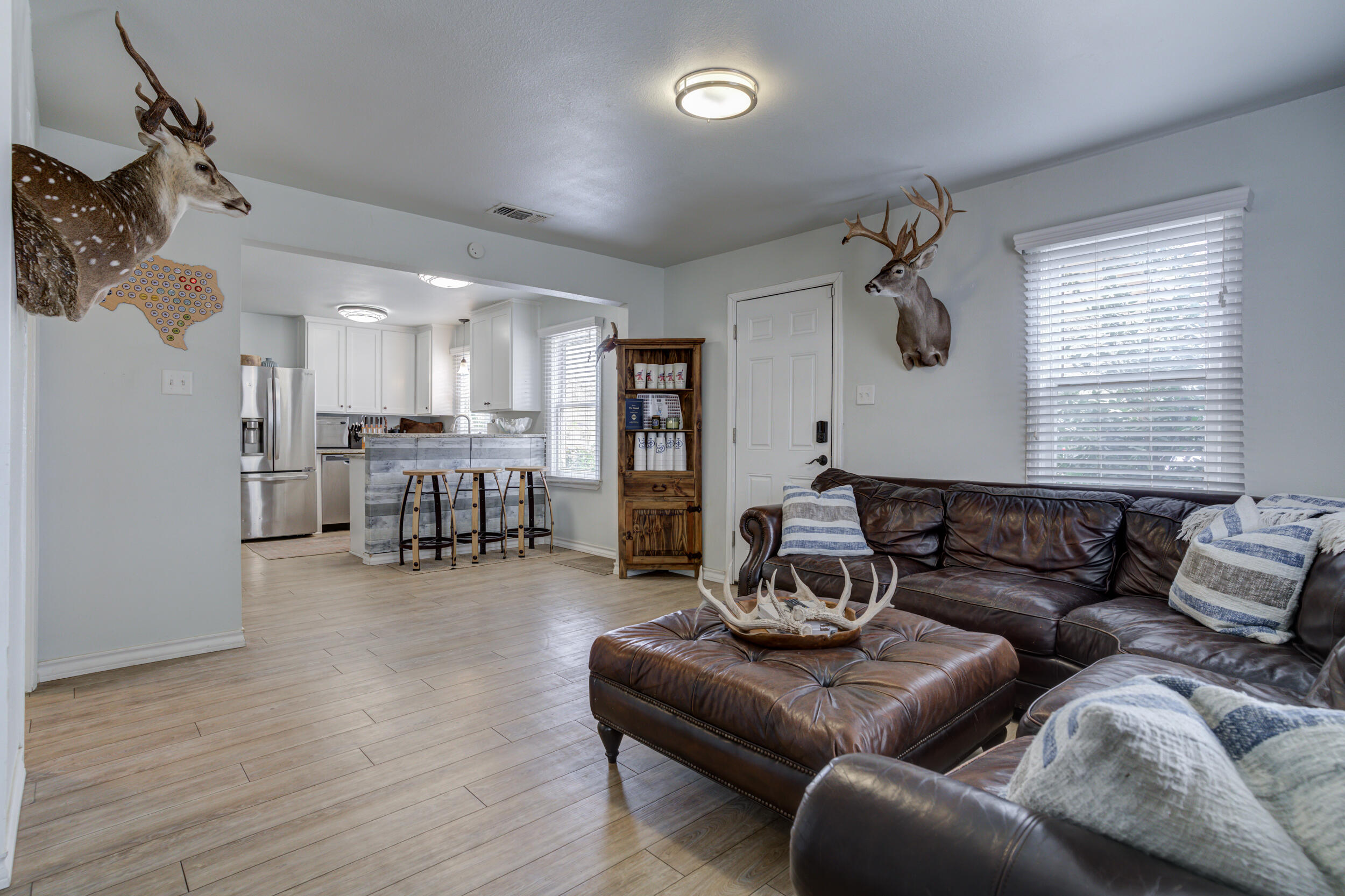 2515 33rd Street Lubbock, TX 79410 - Photo 9 of 41 a living room with furniture and kitchen view