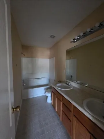 a bathroom with a sink and a shower