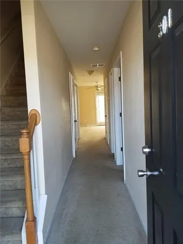 a view of a hallway with windows