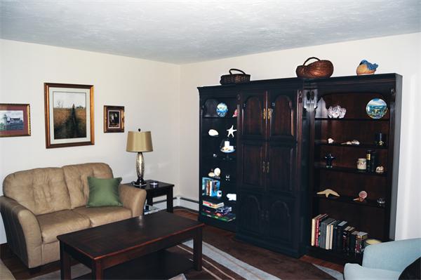 3 Falls Road Sturbridge, MA 01566 - Photo 15 of 28 a living room with furniture and wooden floor