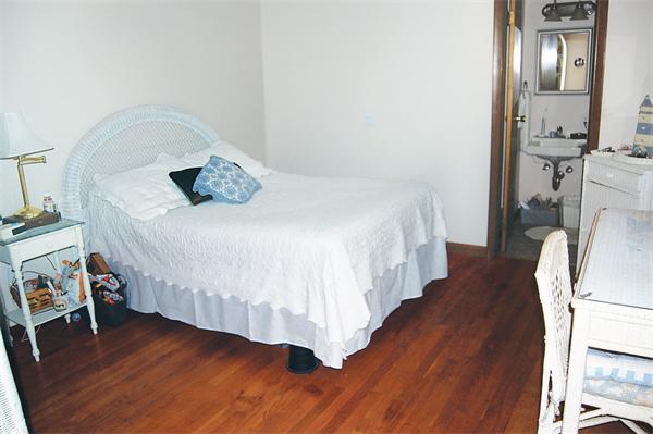 3 Falls Road Sturbridge, MA 01566 - Photo 17 of 28 a bedroom with a bed and wooden floor