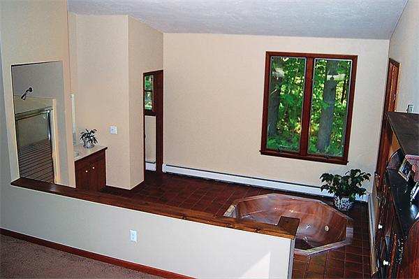 3 Falls Road Sturbridge, MA 01566 - Photo 20 of 28 a bath tub sitting in a bathroom next to a window
