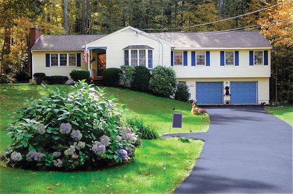 3 Falls Road Sturbridge, MA 01566 - Photo 3 of 28 a front view of a house with a garden