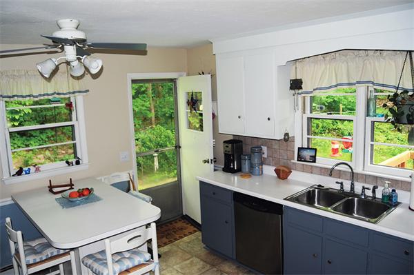 3 Falls Road Sturbridge, MA 01566 - Photo 8 of 28 a kitchen with a sink cabinets and window