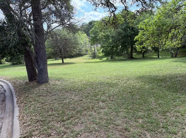 a view of outdoor space with deck and yard