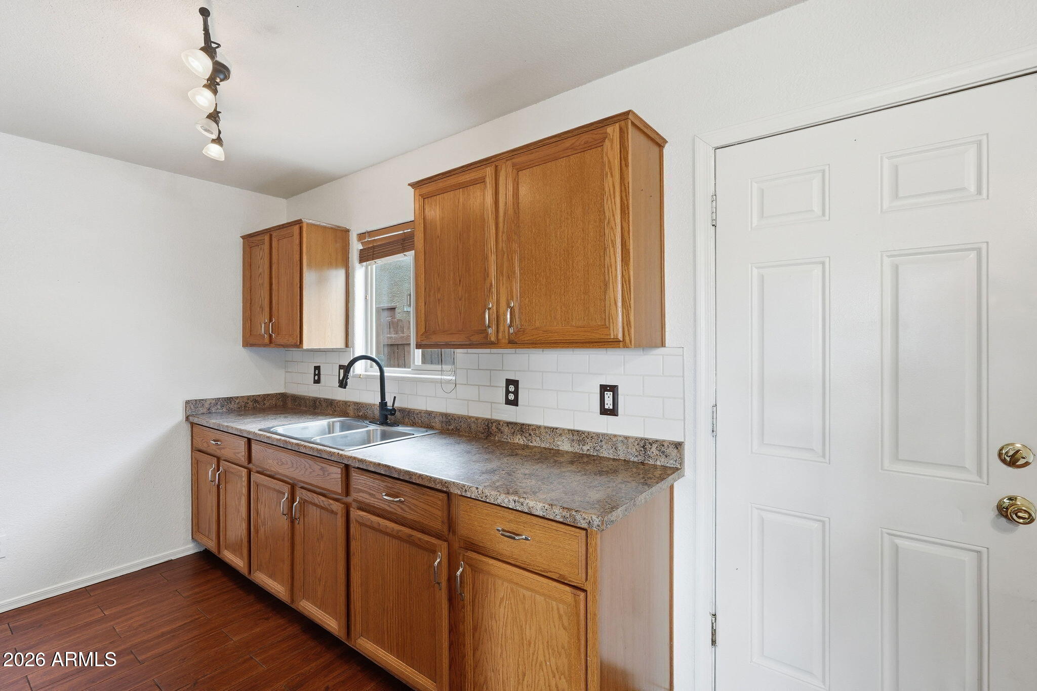 16202 North Desert Sage Street Surprise, AZ 85378 - Photo 8 of 25 a bathroom with a granite countertop sink and a mirror