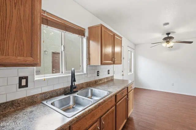 a kitchen with stainless steel appliances granite countertop a sink and a granite counter tops