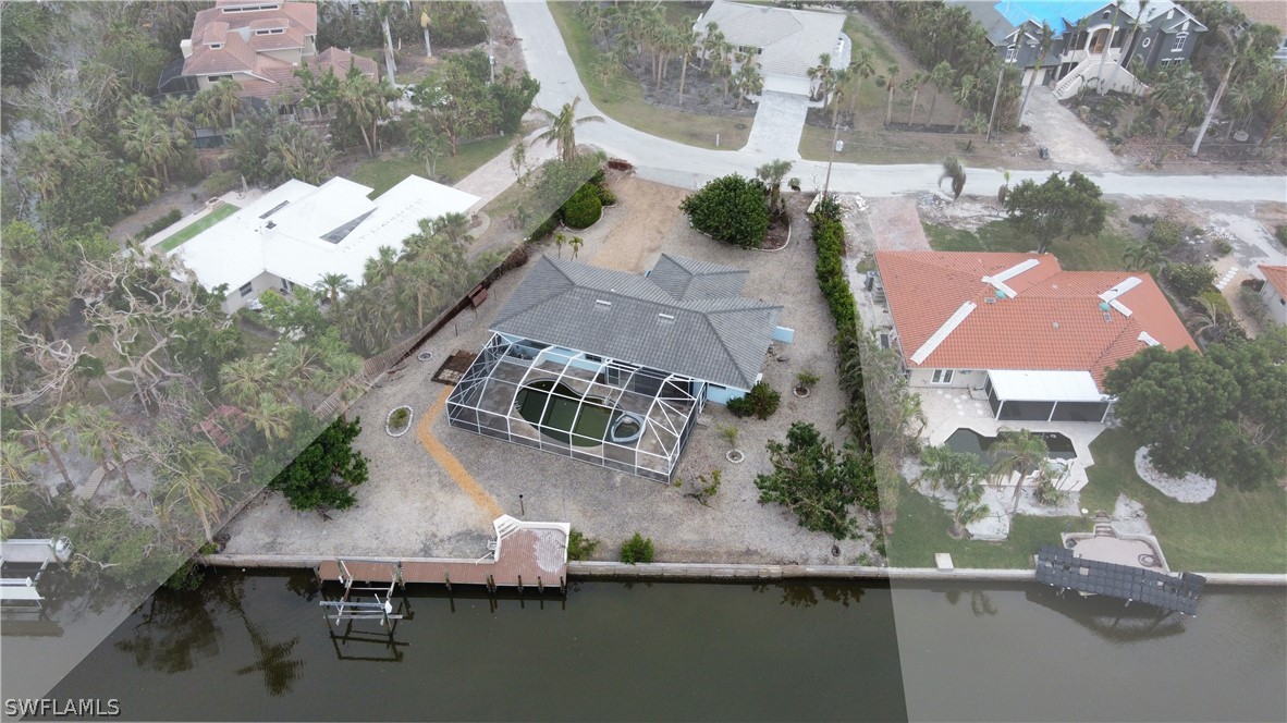 740 Windlass Way Sanibel, FL 33957 - Photo 2 of 22 an aerial view of house with yard