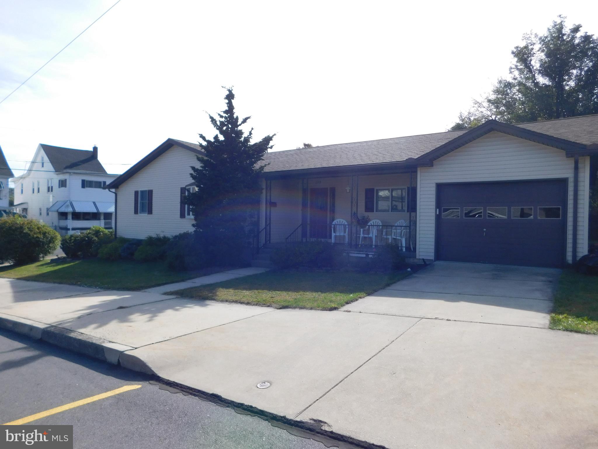 front view of a house and a yard