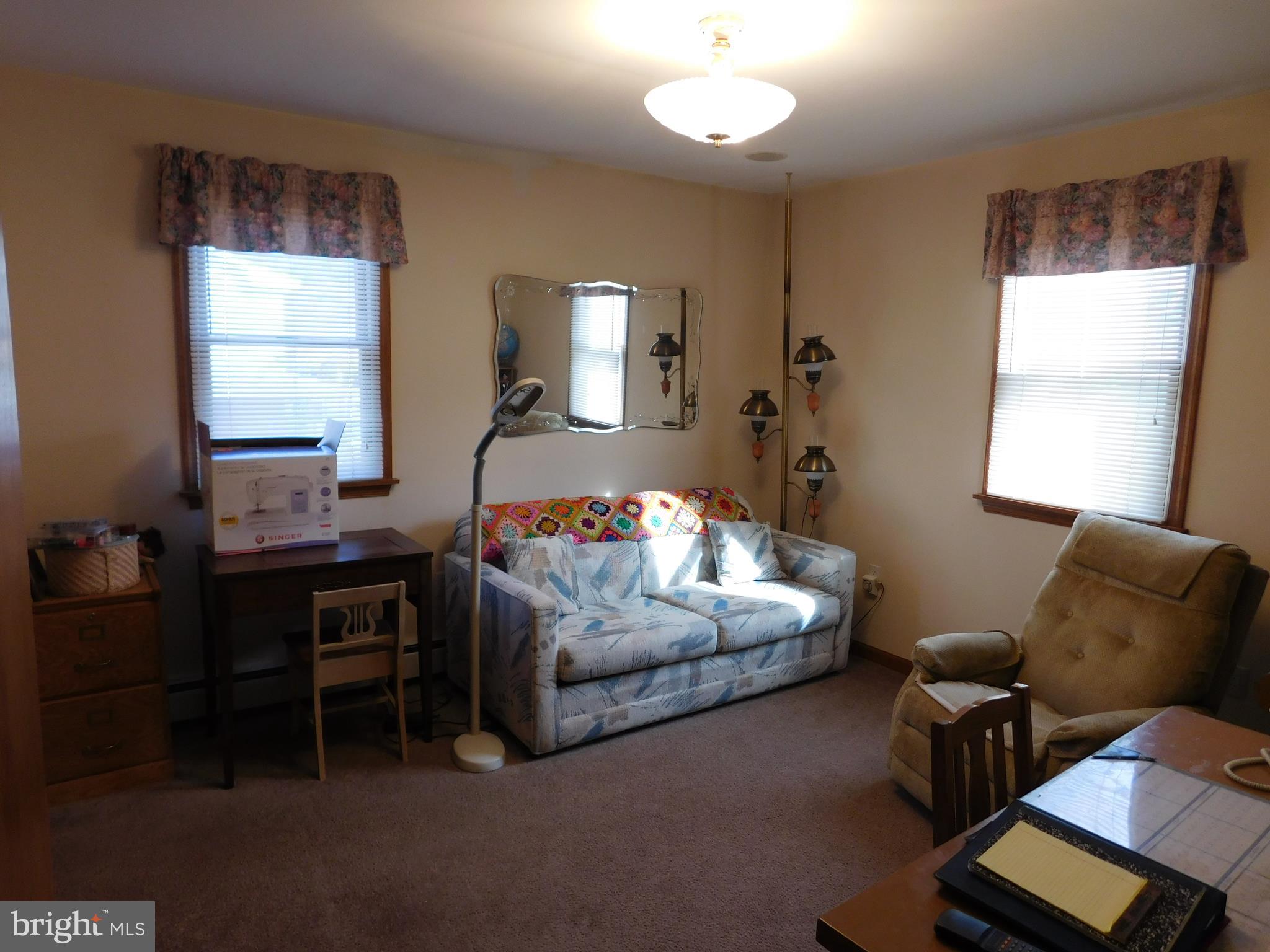 150 East Ruddle Street Coaldale, PA 18218 - Photo 11 of 12 a bedroom with a bed and wooden floor