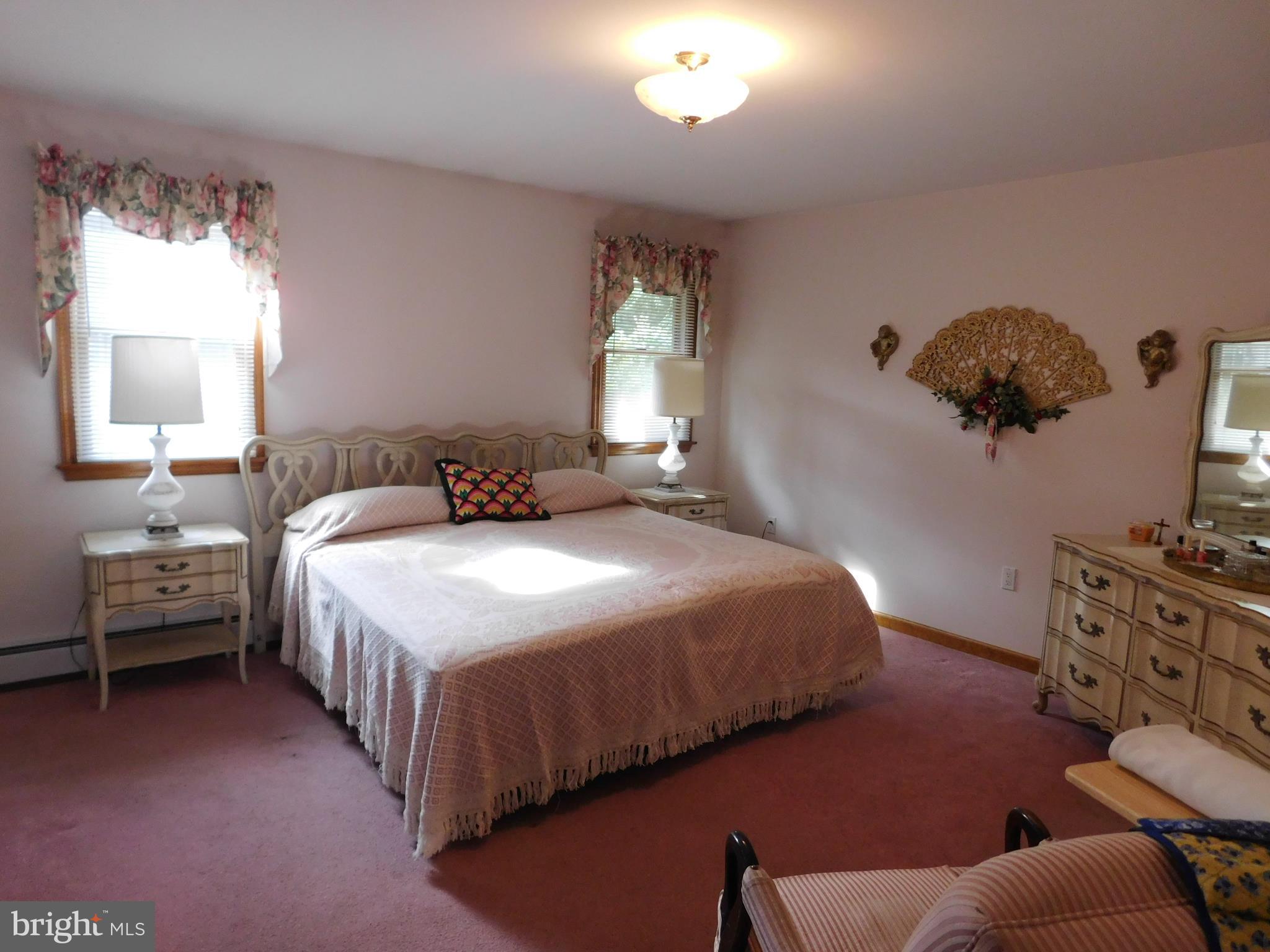 150 East Ruddle Street Coaldale, PA 18218 - Photo 7 of 12 a bedroom with bed and window