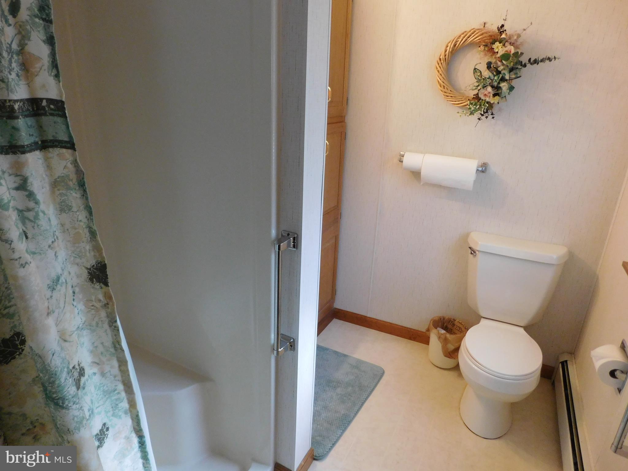 150 East Ruddle Street Coaldale, PA 18218 - Photo 8 of 12 a white toilet sitting next to a shower