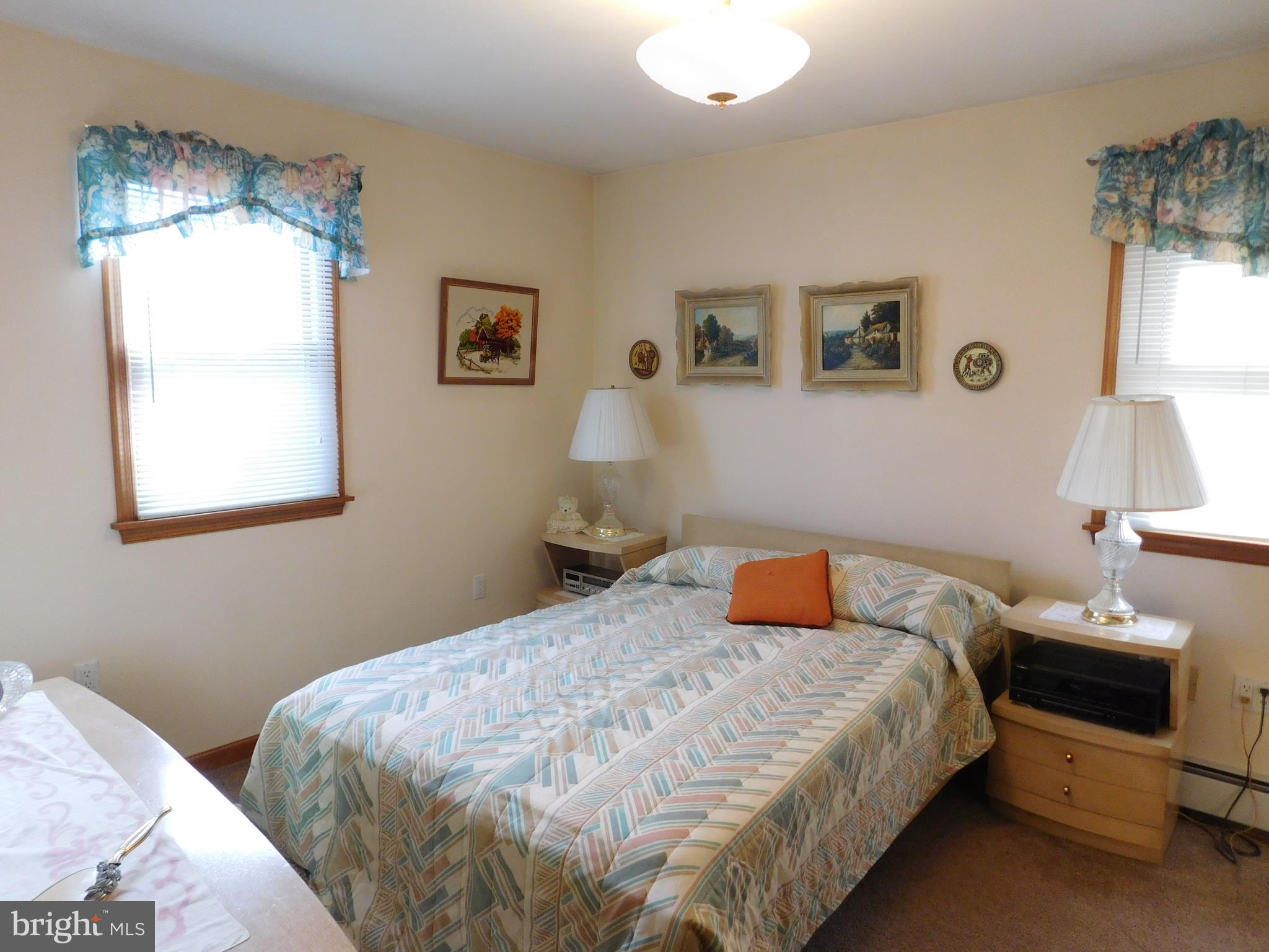 150 East Ruddle Street Coaldale, PA 18218 - Photo 9 of 12 a bedroom with a bed and a window