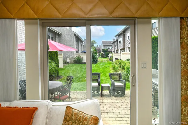 a bathroom with a toilet a sink and a window