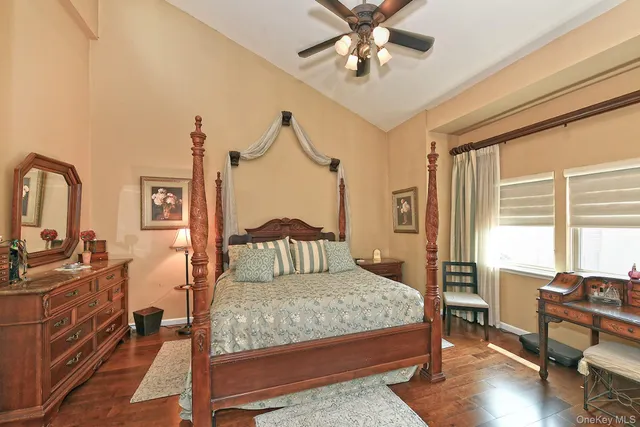 a bathroom with a granite countertop sink mirror and shower