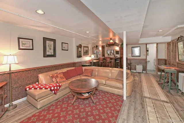 a dining room with a sink a table and chairs