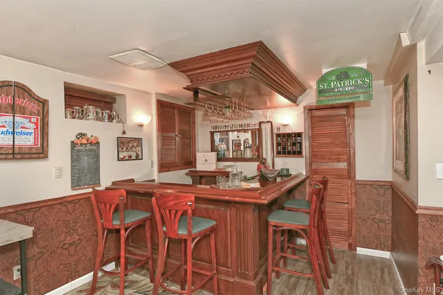 a view of a house with backyard sitting area and furniture