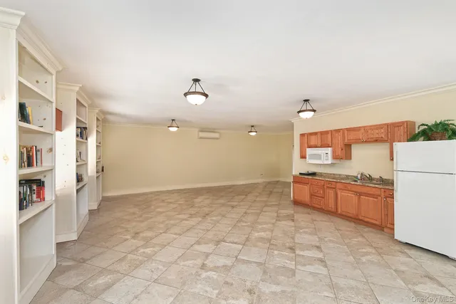 a view of a swimming pool with an outdoor space and seating area