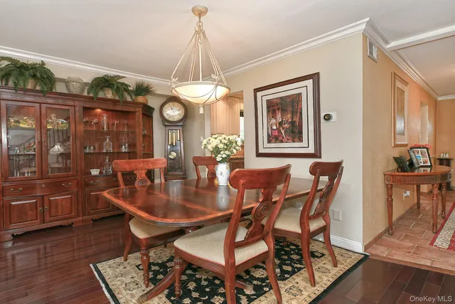 a living room with fireplace furniture and a large window
