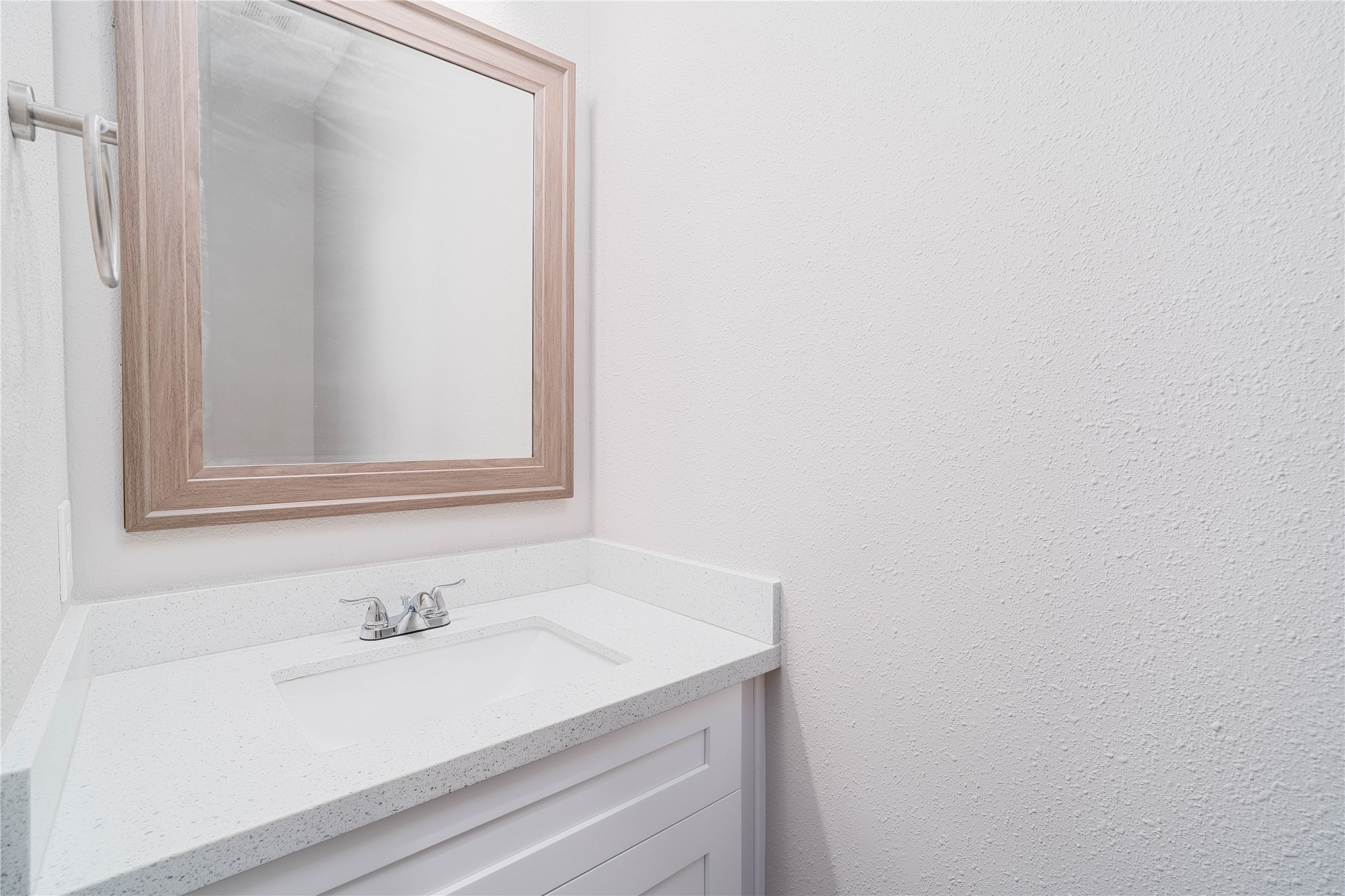 231 McCormick Street Columbus, TX 78934 - Photo 23 of 27 Half Bathroom – Convenient powder bath with a modern vanity, quartz countertop, and clean, minimalist finishes.