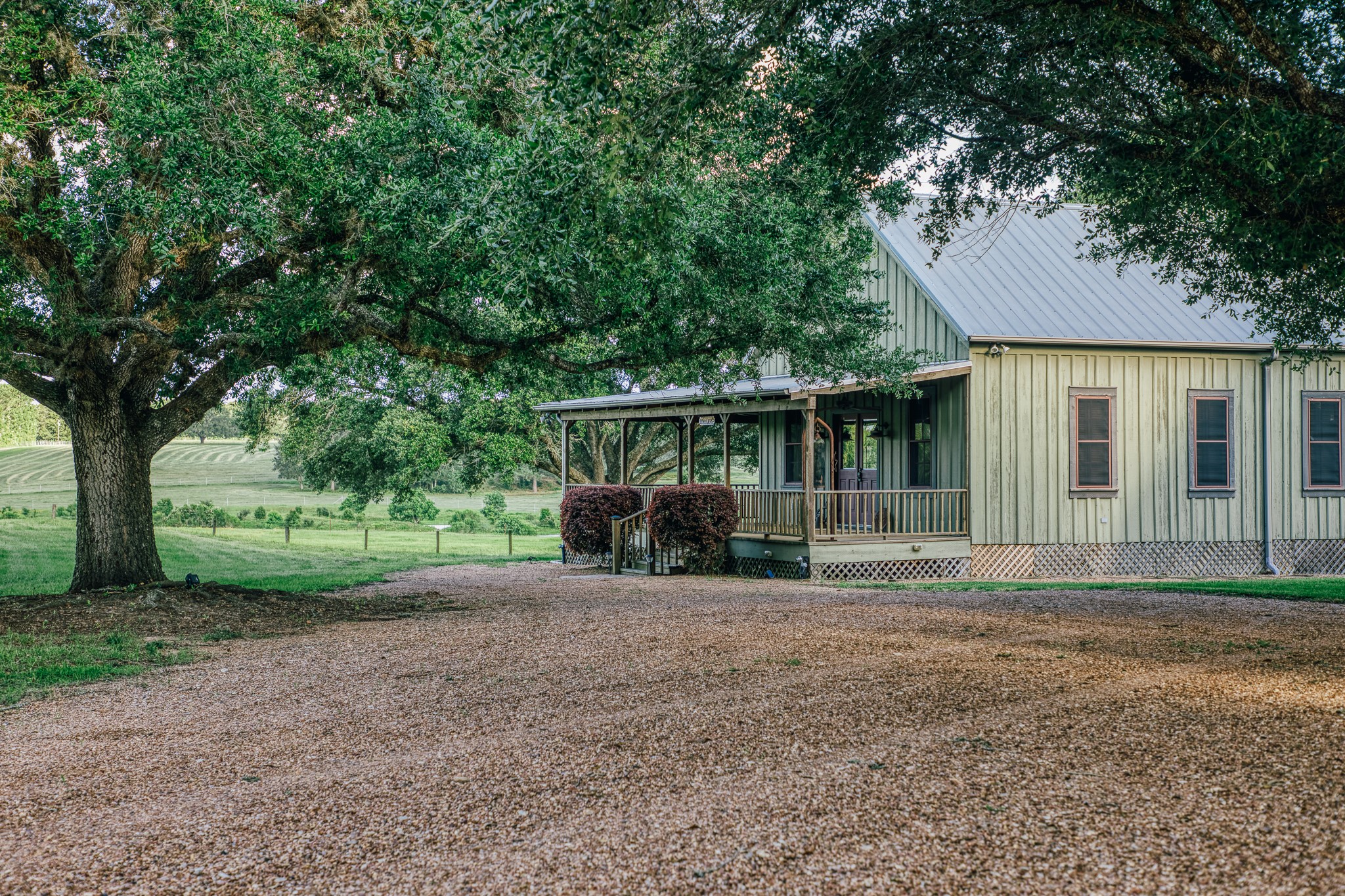 1034 Hilbun Road New Ulm, TX 78950 - Photo 31 of 49 A rare piece of Texas history, thoughtfully relocated this schoolhouse from Frelsburg and reimagined as a charming entertainment retreat complete with custom bar, game room, bathroom, and wraparound porch.