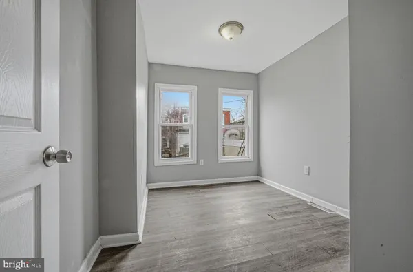 an empty room with windows