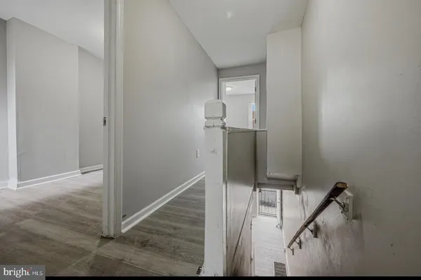 a view of a hallway with staircase