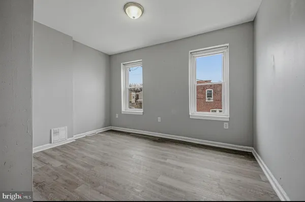 an empty room with windows