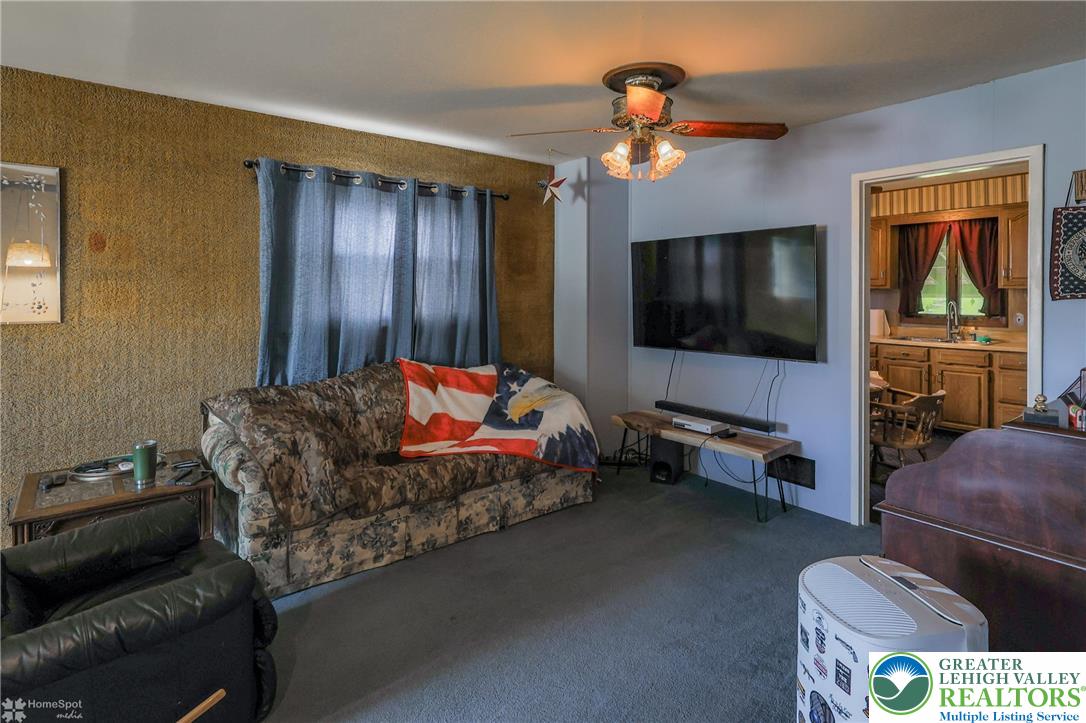1336 Greenview Drive Bethlehem, PA 18018 - Photo 11 of 58 a living room with furniture and a flat screen tv