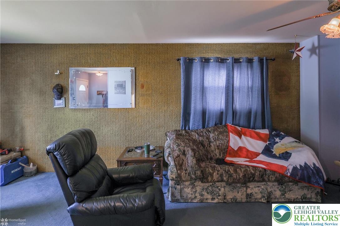 1336 Greenview Drive Bethlehem, PA 18018 - Photo 12 of 58 a living room with furniture and a window