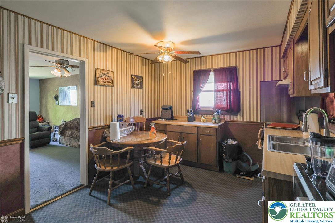 1336 Greenview Drive Bethlehem, PA 18018 - Photo 19 of 58 a view of a a dining room with furniture window and wooden floor
