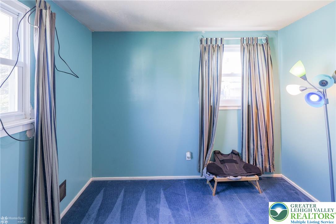 1336 Greenview Drive Bethlehem, PA 18018 - Photo 26 of 58 an empty room with wooden floor and windows