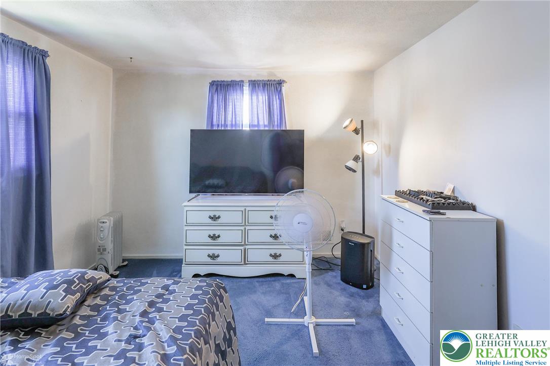 1336 Greenview Drive Bethlehem, PA 18018 - Photo 38 of 58 a living room with furniture and a flat screen tv